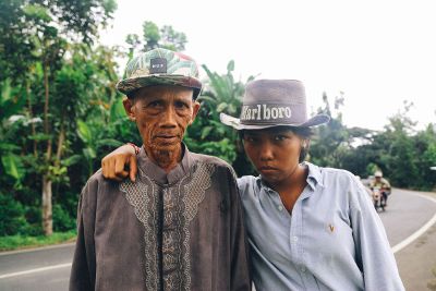 man and boy hugging for picture