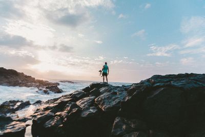 a person standing by the ocean