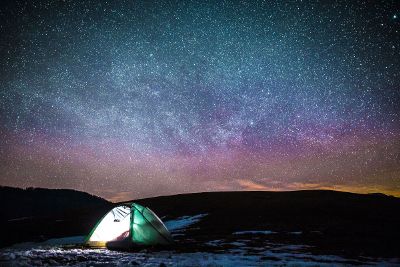 tent camping under beautiful night sky