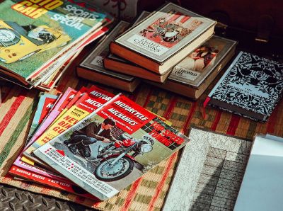books and magazines on a rug