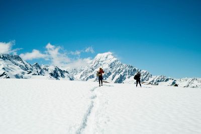 two hikers on a mountaintop