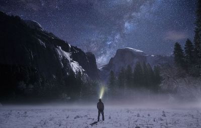 man looking at the night sky