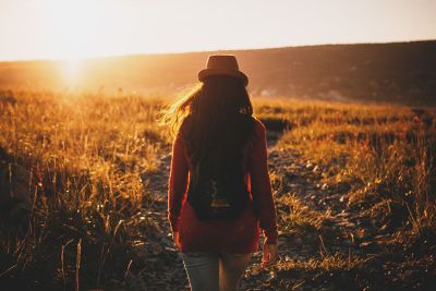 woman walking through field