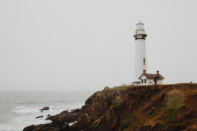 a lighthouse next to the ocean