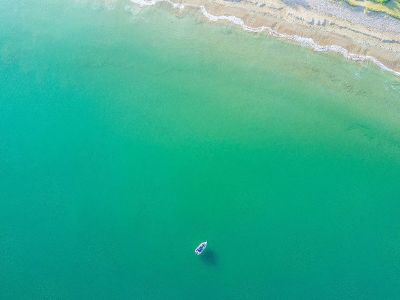 lonely boat in an ocean