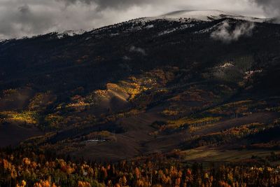 snowcapped mountain and valley in fall