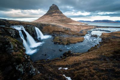 mountain by a water fall