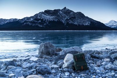 frozen lake surrounded by mountains