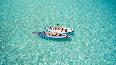 women on paddle boards