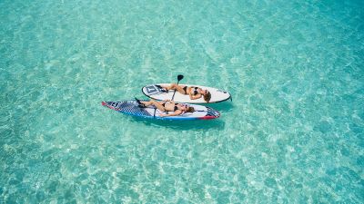 women on paddle boards