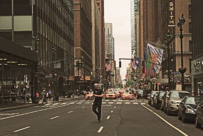 pedestrian crossing the road