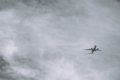 airplane in cloudy sky