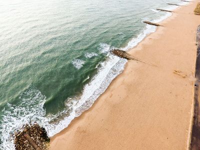 clear beach sand and ocean