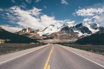 mountain highway with cloudy skies