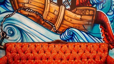 couch amongst sea mural