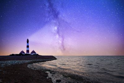 lighthouse and the milky way