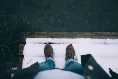 snowy dock near water