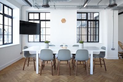 dining area with dining table and eight chairs