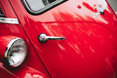 trunk handle on red car