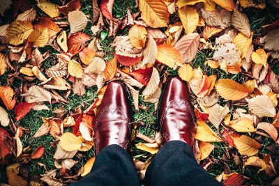 standing in autumn leaves