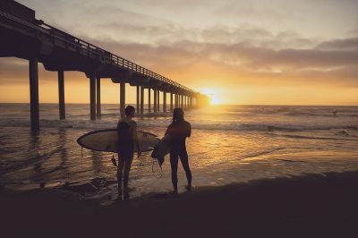 couple with surfboards