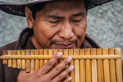 man playing mouth organ