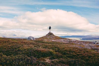 a person standing on a rock