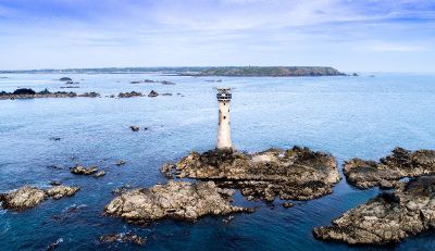 lighthouse on blue water