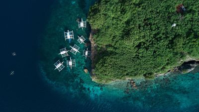 boats on water near island