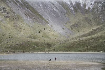 two people at base of mountain