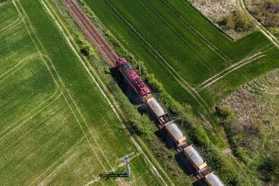 train passing through green pastures