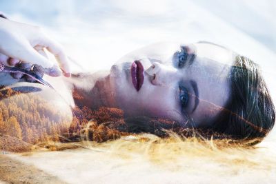 woman laying in forest