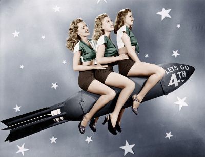 women riding rocket
