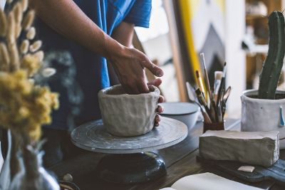 person molding clay