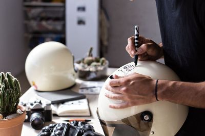 person drawing on helmet