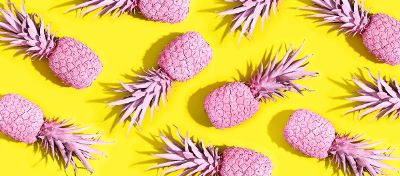 pink pineapples on a yellow background