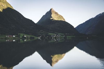 village in mountains by lake