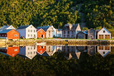 houses next to lake and mountain