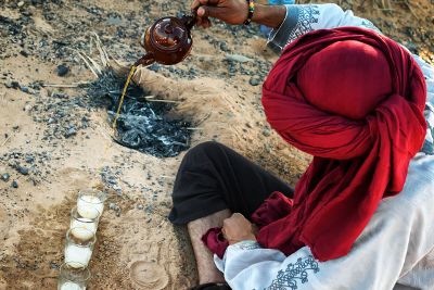 man pouring tea