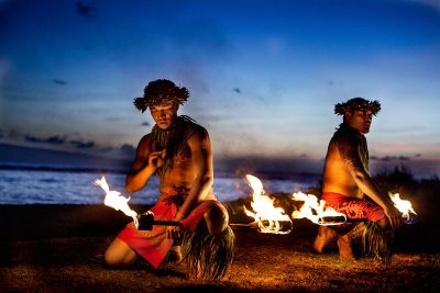 polynesian men with torches