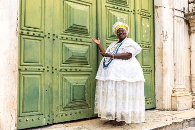 woman in front of large doors